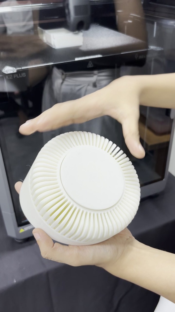 Large 3D printed centrifugal impeller held in two hands
