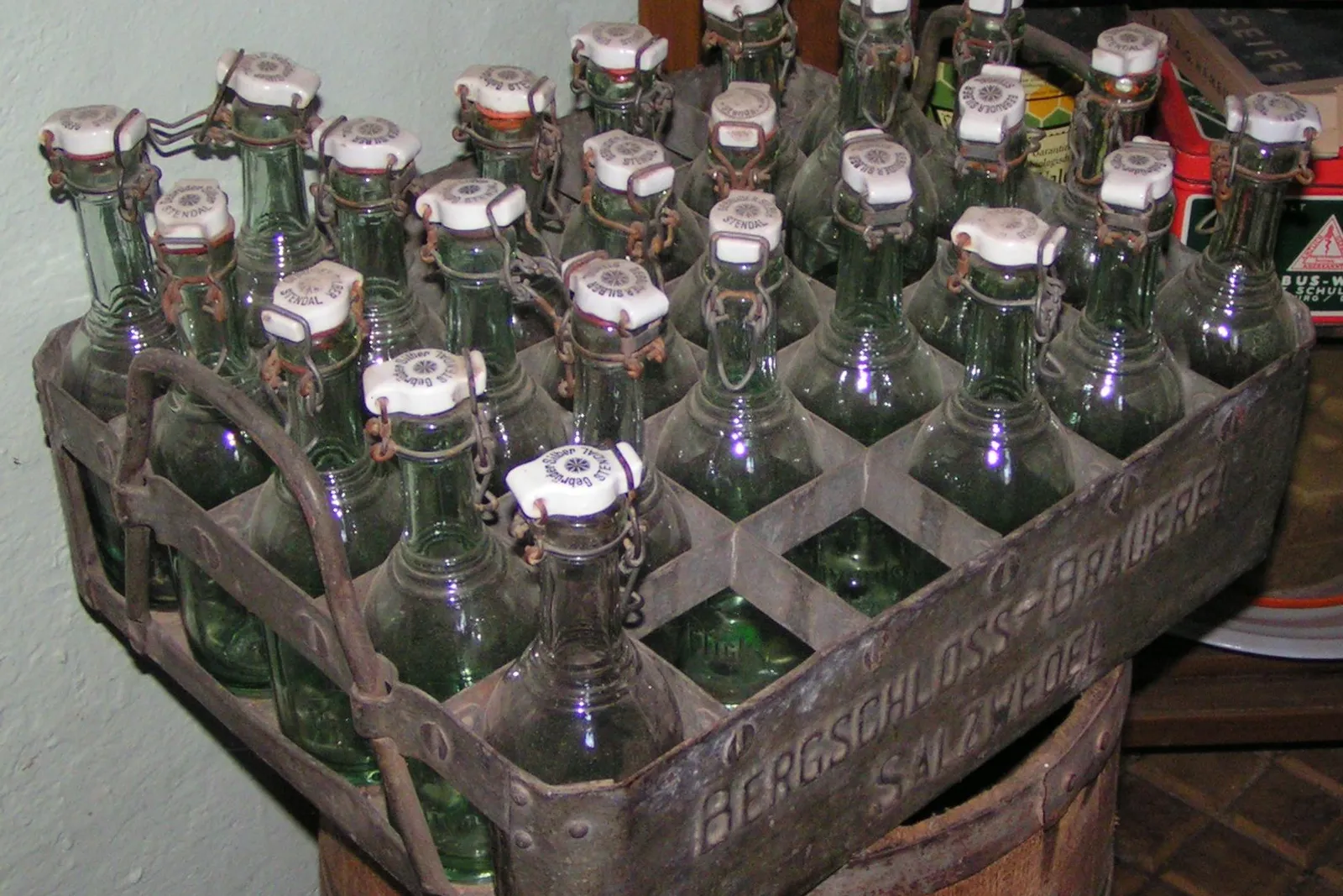 Returnable swing-top glass bottles standing in a crate